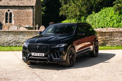 Lister Stealth — Front three-quarter with the church behind