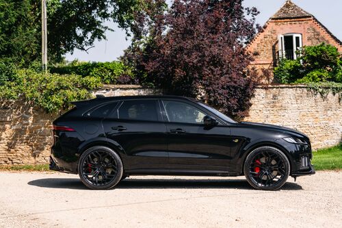 Lister Stealth — Side profile against the stone wall